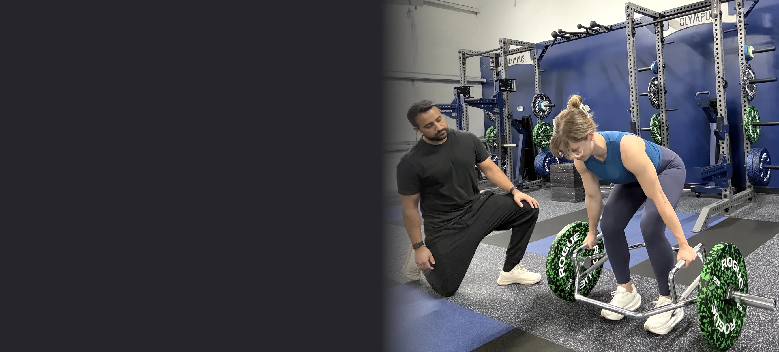 TJ coaching an athlete through a trap-bar deadlift
